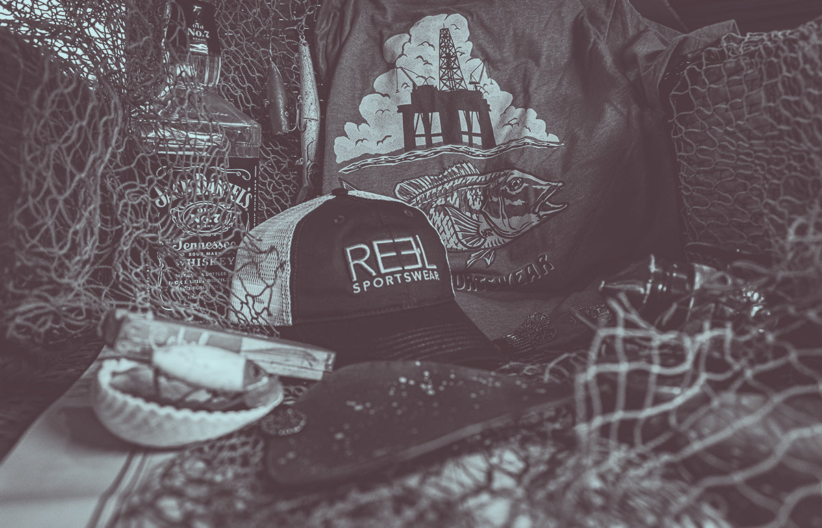 Image of a fisherman holding a large catch, wearing Reel Sportswear's performance fishing gear, demonstrating the durability and longevity of the brand's apparel