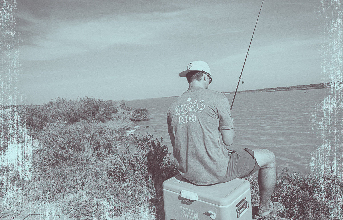 An image of a guy sitting on a ice chest fishing with a fishing rod.