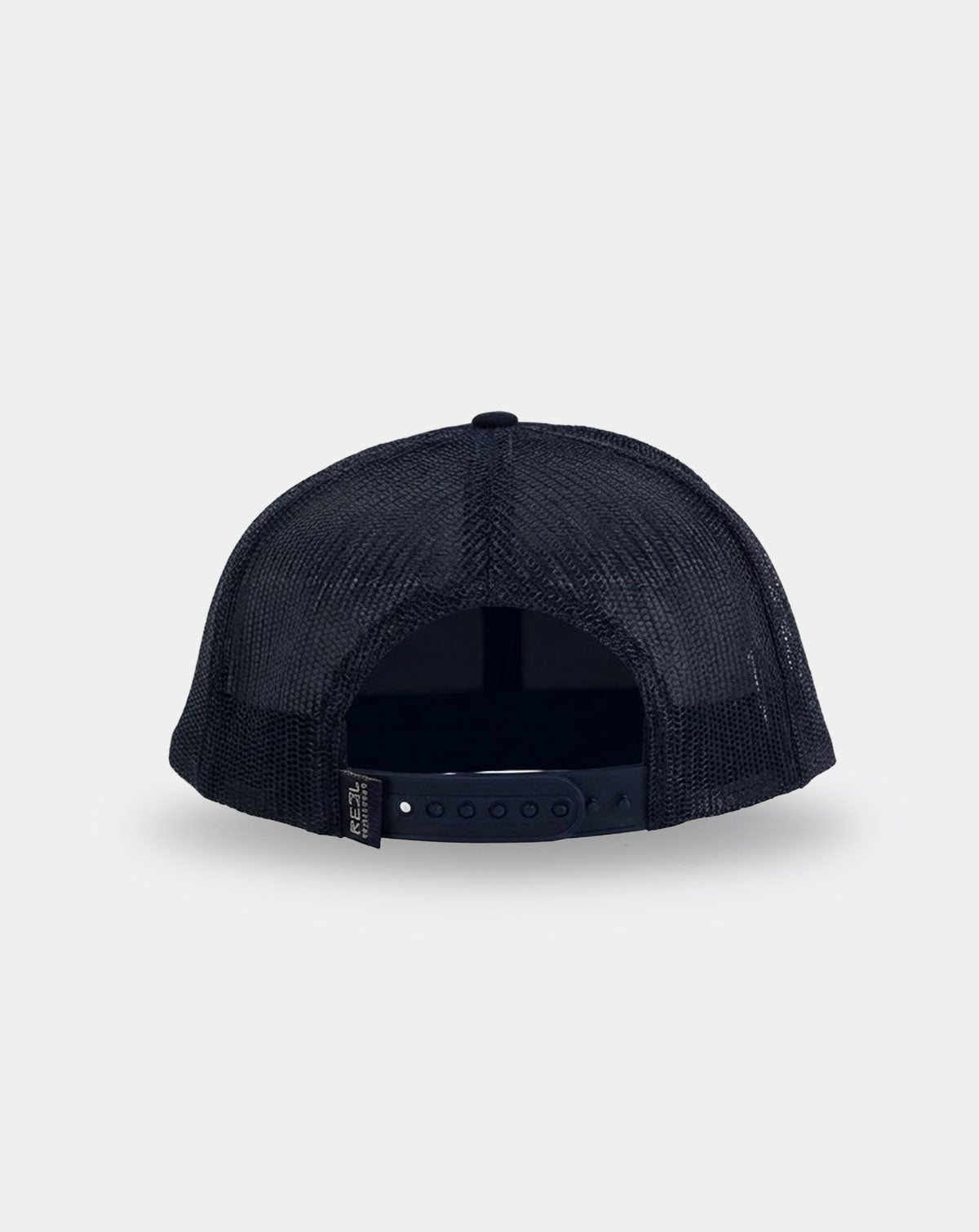Reel Sportswear Bosun Navy Trucker Hat — back view showing all-black mesh panels and adjustable snapback closure with RS branded tag