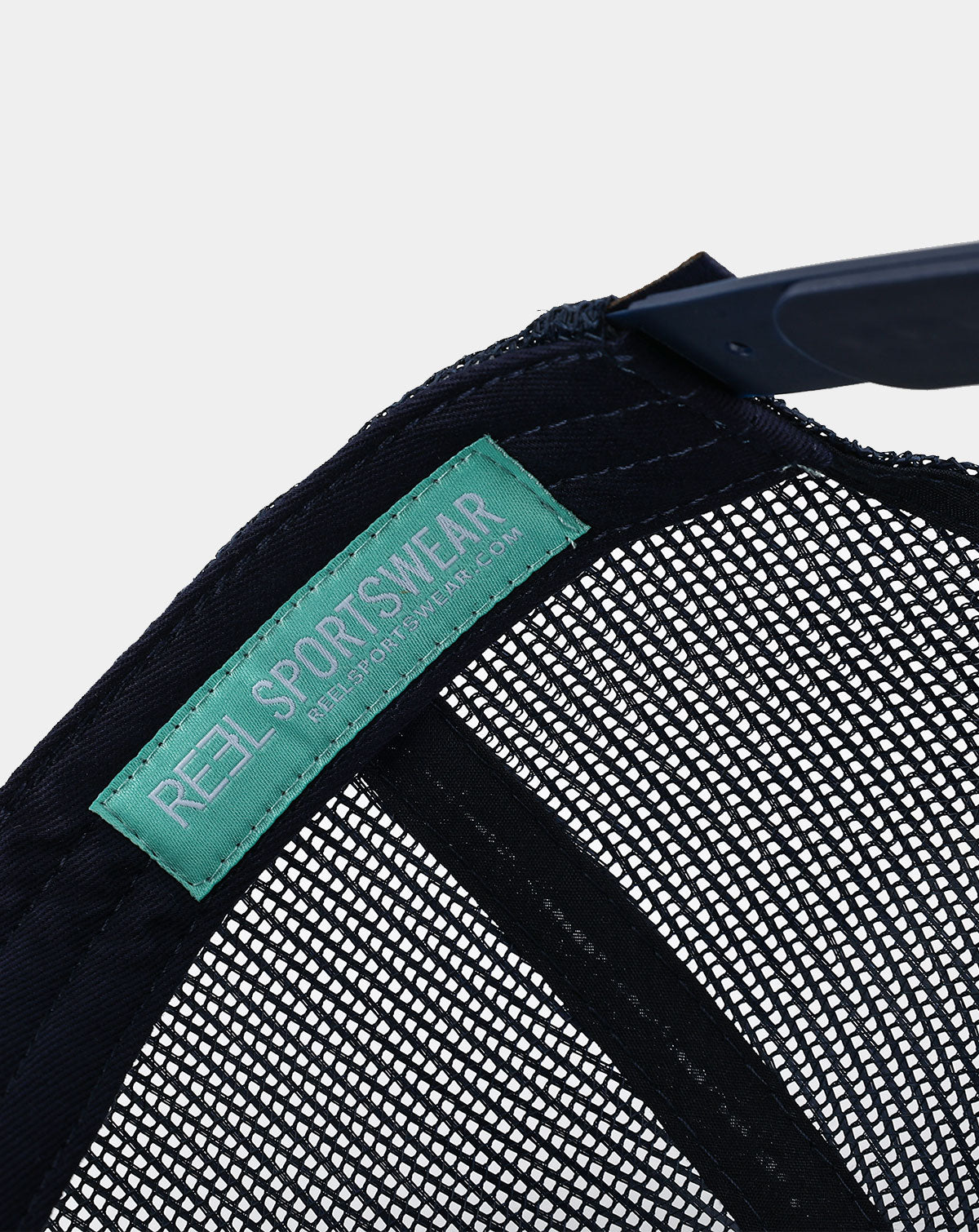 Reel Sportswear Bosun Trucker Hat — interior RS branded label sewn into navy mesh panel