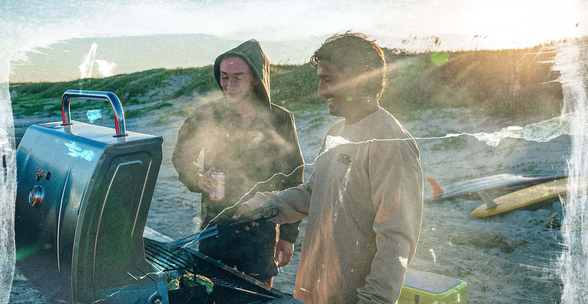 Two people grilling outdoors with a scenic background Reel Sportswear -- Holiday Mystery Haul