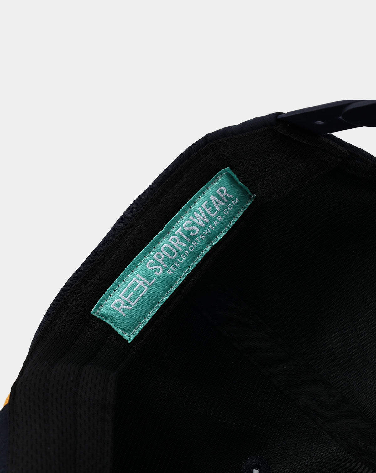 Reel Sportswear El Capitan Hat — interior teal RS branded label sewn into navy performance nylon panel