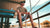 Reel Sportswear - Fisherman sitting on a dock wearing a reel sportswear fishing tee