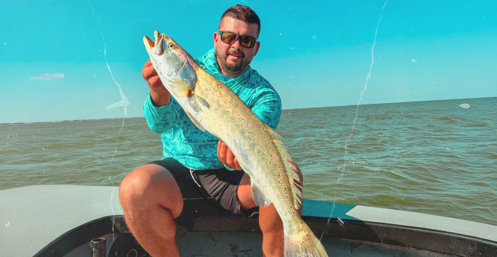 Tide Tamer Men's Hooded Longsleeve Fishing Shirt. Fishing Hoody, catching trout on the laguna madre